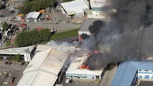 Fire crews are responding to 2 alarm warehouse in North Seattle