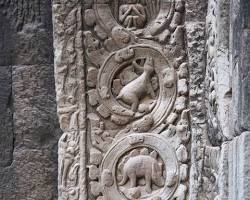 Close-up of an ancient Cambodian engraving on a temple wall