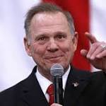 Republican Moore embraces Donald Trump