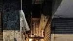 dead, missing 100-year-old building collapses