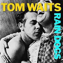 Album_Tom Waits-Rain Dogs. Prevod pesme. Pokisli psi. Unutar pokvarenog sata prosipajući vino sa svim pokislim psima. Taksi, rađe bismo peške. - Album_Tom-Waits-Rain-Dogs