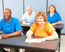 group of adult learners sitting in a classroom