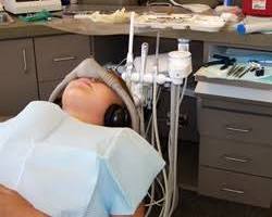 Image of patient receiving nitrous oxide sedation in a dental chair