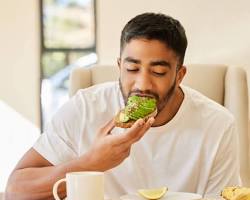 Image of person enjoying a meal with avocado