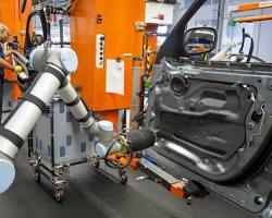 Image of robotic arm in a manufacturing plant or a humanoid robot