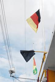 Image result for ppp flag on half mast guyana