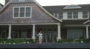 A person standing in front of a house.