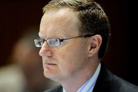 Assistant governor (economics) of the Reserve Bank Dr Philip Lowe listens during the House of Representatives economics committee hearing in Canberra, ... - 4411282-3x2-940x627