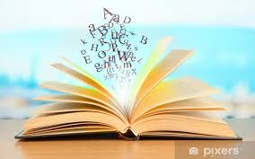 Wall Mural Open book with letters on bright background