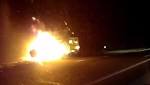 Queensland Police footage shows man towing his blazing trailer along Bruce Highway