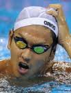 Japan&#39;s Junya Koga removes his swimming. By: FRANCOIS XAVIER MARIT - 120094997