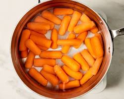 Image of Boiling carrots in a pot