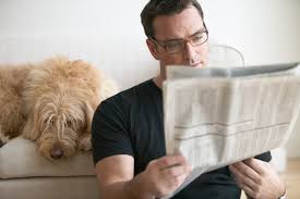 Image result for pictures of person reading newspapers