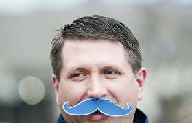 Ann Arbor resident and season ticket holder Kelly Cox wears a fake mustache for Movember men&#39;s - 11102012_SPT_UM_Northwestern_Football_DJB_0176_fullsize