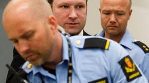 ... extremist Anders Behring Breivik (C) arrives on June 22, 2012 in the courtroom in Oslo on the last day of his trial. (AFP Photo / POOL / Heiko Junge) - june-arrives-norwegian-right-wing.si