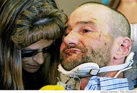Firefighter Rick Schroeder, sister Laura Villa leans down to speak with her brother during a press conference at Mercy Medical Center in Redding Calif, ... - 628x471