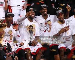 Image of LeBron James, Dwyane Wade, and Chris Bosh celebrating a Miami Heat win