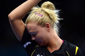 <b>Georgina Pota</b> of Hungary wipes her face while playing against Tian. - 149471119-georgina-pota-of-hungary-wipes-her-face-gettyimages