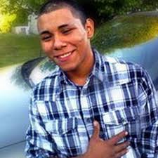 GRAND RAPIDS - Friends and family of Miguel Angel Lopez lit candles Saturday to mark the spot where the 17-year-old was shot and killed while he rode his ... - 9870279-large