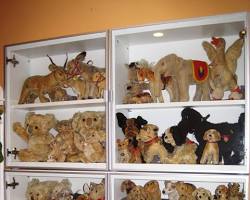 Image of Vintage teddy bear collection displayed on a shelf