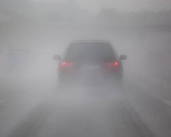 Image of car driving in foggy conditions