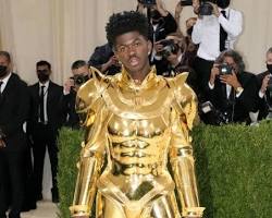 Lil Nas X in a gold-plated suit of armor