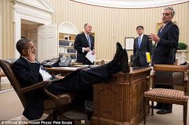 Image result for two feet up on the table