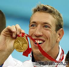 Alain Bernard of France shows off his gold medal. Eamon Sullivan of Australia took the silver. - 000bdb4a30270a0f1e3e55