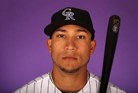 Carlos Gonzalez #5 of the Colorado Rockies poses for a portrait during spring training photo day at Salt River Fields at Talking Stick on February ... - Carlos%2BGonzalez%2BColorado%2BRockies%2BPhoto%2BDay%2BvIZqCf1M-lOl