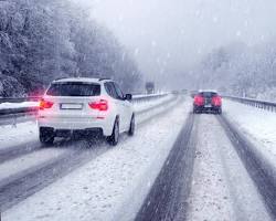 Image of car driving in the snow