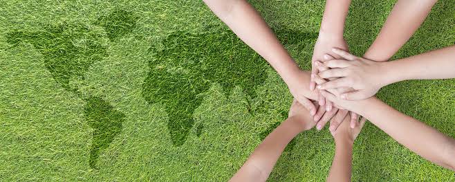 Global Community Teamwork Csr And Esg Environmental Energy Saving Collaboration Among Young Children With Partnership Hands Stack Together On Green Background For Sustainable Development Goal Concept Stock Photo - Download Image Now - iStock