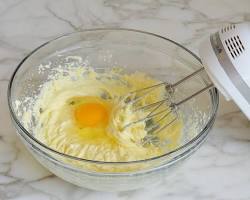 Gambar Beat in the eggs one at a time, then stir in the vanilla