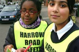 Sinead Riley and Henna Iqbal, both 11, of Belmont Middle School, become traffic wardens for the afternoon - 4B6CE699-957F-1608-C2776ABA30BB12D3