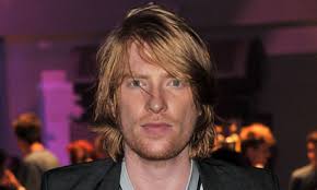 On a fiercely sunny afternoon in London, Domhnall Gleeson lopes into the hotel courtyard in a blue hoodie and grey jeans, and sticks out a hand to shake ... - Domhnall-Gleeson---Gettin-010