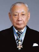 Takeo Yoshino is shown wearing the award he received at the Royal Palace on November 9, 2009. - Takeo