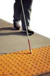 blind person finding crosswalk 